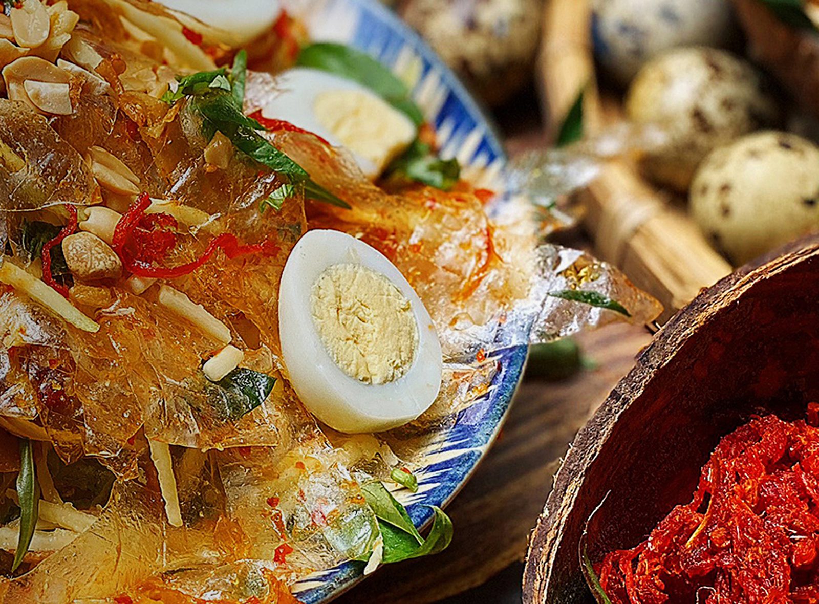 Bánh tráng trộn tossed with herbs, quail eggs and peanuts